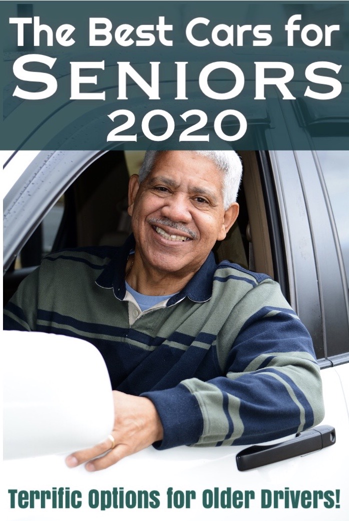 Smiling older man wearing a blue-and-green-striped collared shirt sitting in a car and leaning one arm out the open window