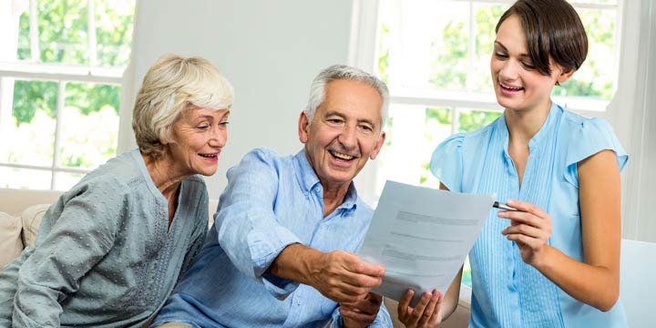 Granddaughter Helping Grandparents with Taxes