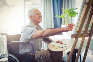 Retired Man Working on a Painting