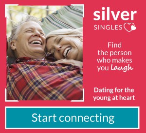 Happy senior couple laughing together with text for Silver Singles dating service advertisement for the young at heart