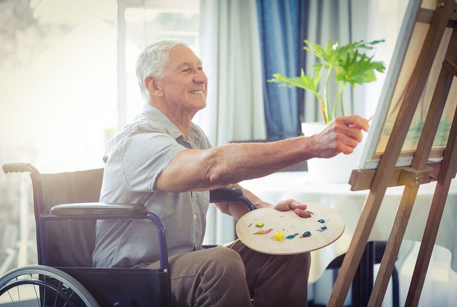 Retired Man Working on a Painting