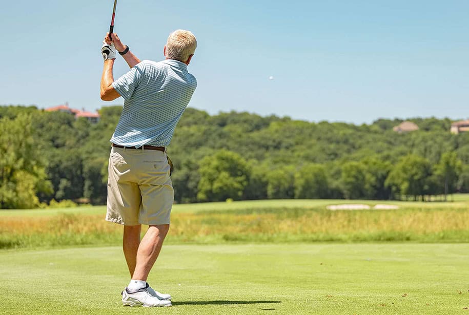 Senior man playing golf