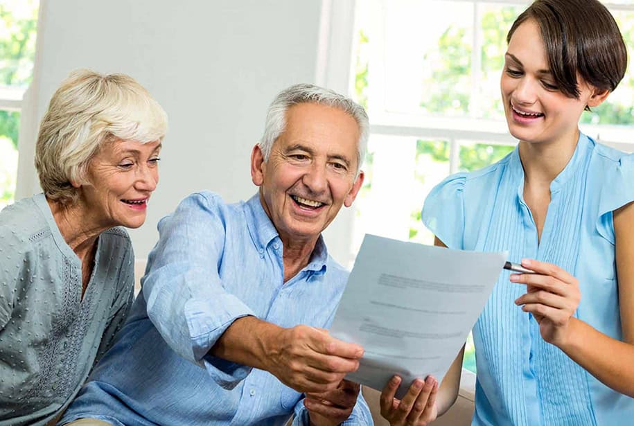 Granddaughter Helping Grandparents with Taxes