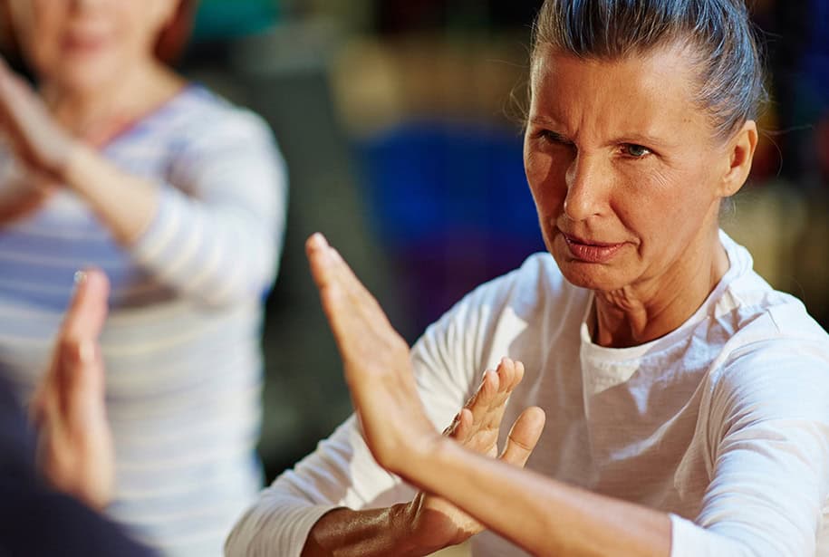 Senior woman participating in a self-defense class