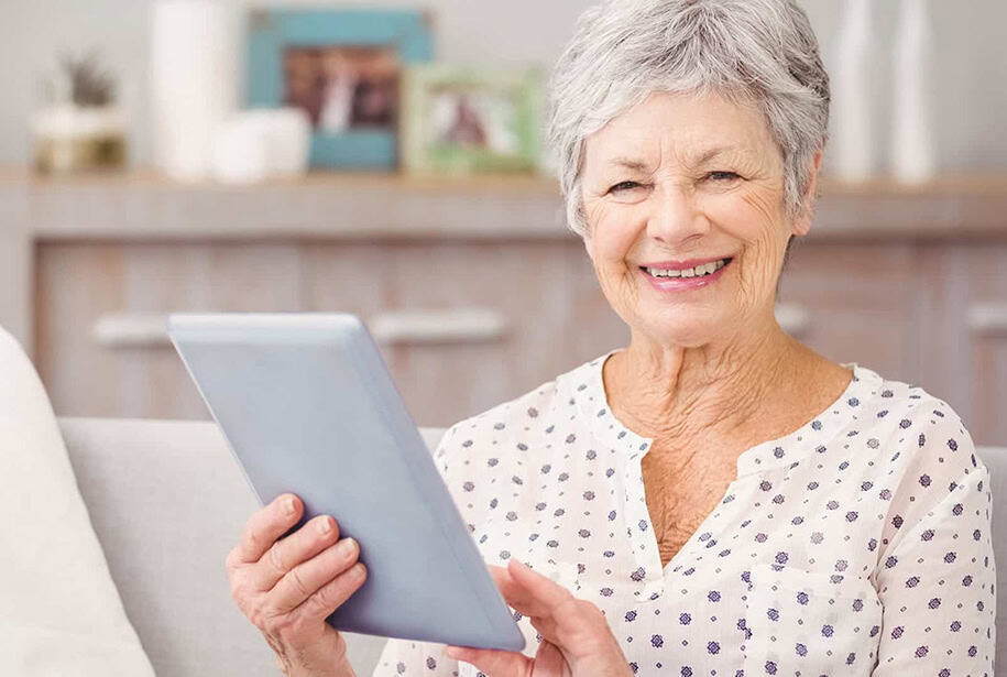 Senior with tablet